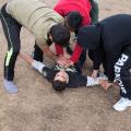 Fahed had a nasty fall. His friends rush over to him to console him with a fake reanimation attempt.